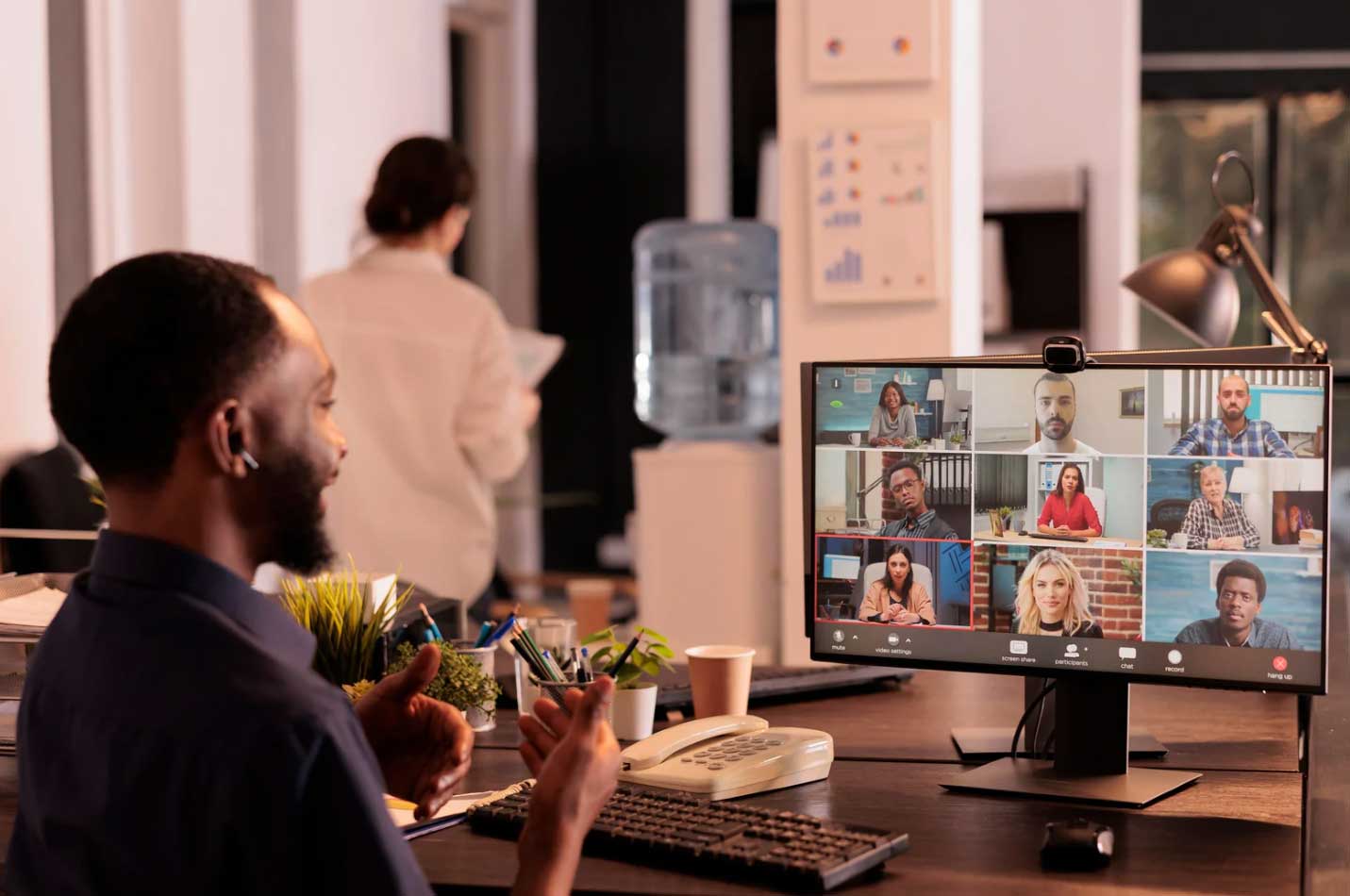 Remote Work Document management system in place while worker video chats with coworkers