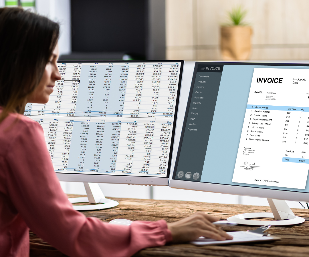 An employee sits at desk and uses accounts payable automation to create invoice